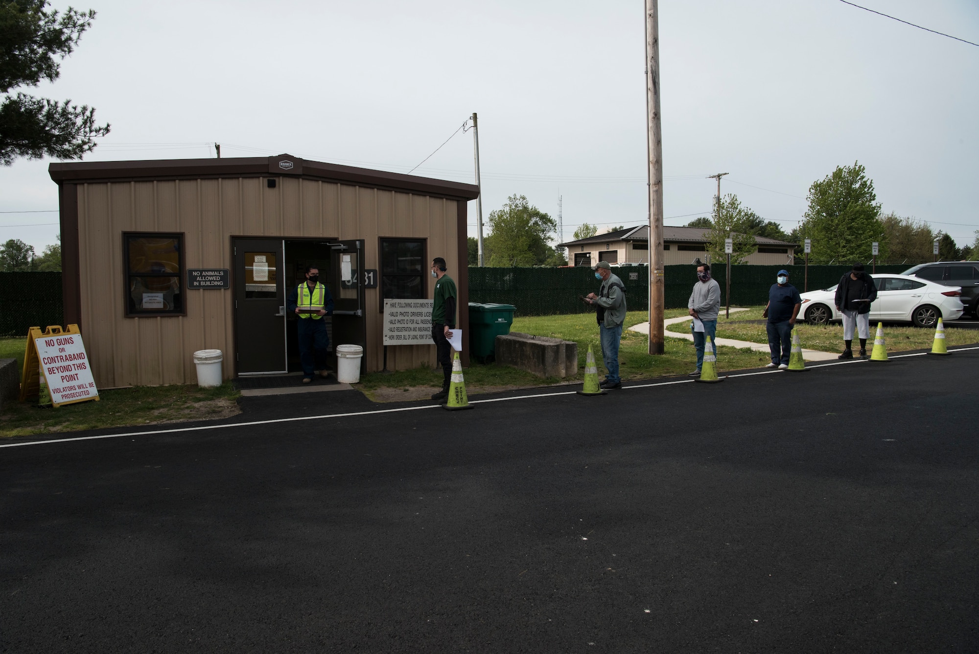 A photo of truck drivers lining up to be seen.