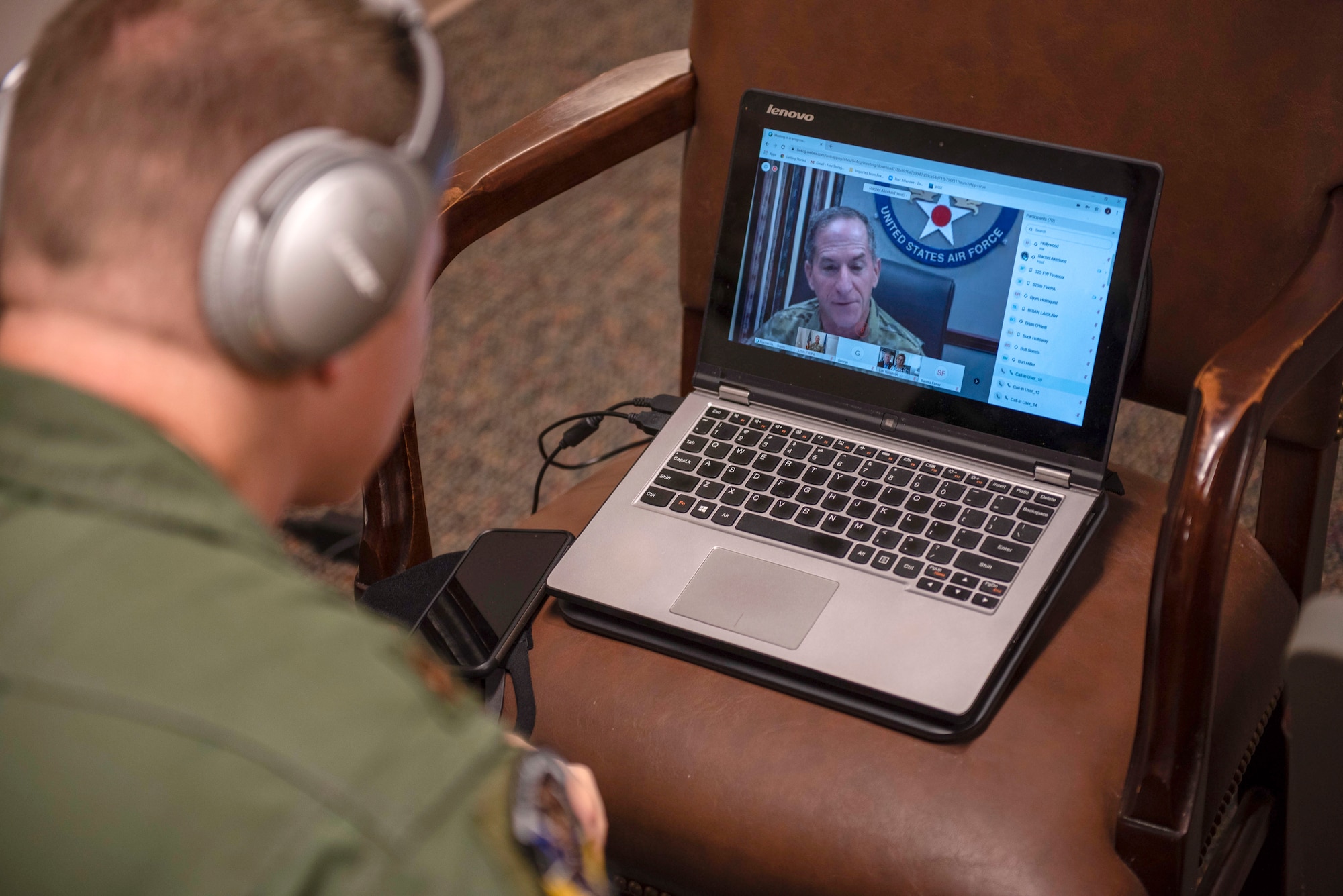 U.S. Air Force Maj. Jason Spicer, 337th Air Control Squadron, assistant director of operations, watches U.S. Air Force Chief of Staff Gen. David Goldfein during a virtual ceremony held at the 337th ACS Air Battle Manager schoolhouse at Tyndall Air Force Base, Florida, May 26, 2020. Goldfein was the guest speaker for the dedication event and honored retired Gen. Lori Robinson for whom Building 1285 was recently named after. (U.S. Air Force photo by Staff Sgt. Magen M. Reeves)