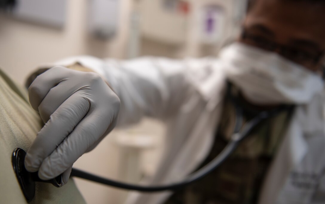 U.S. Air Force Capt. Everlino Ramos, 36th Medical Operations Squadron family health physician assistant, checks the heartbeat of a patient at Andersen Air Force Base, Guam, May 16, 2020.