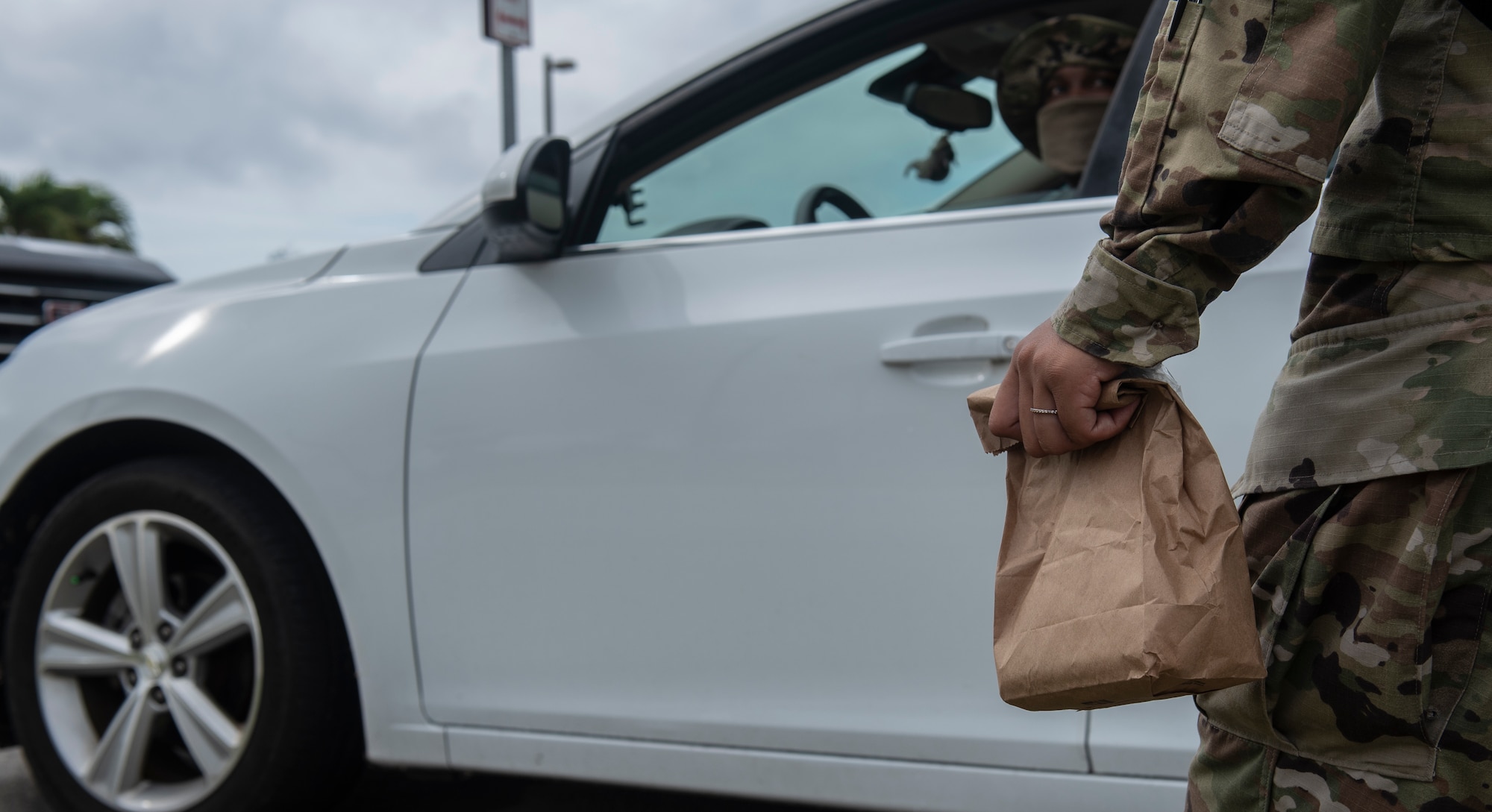 U.S. Air Force Senior Airman Patience Letourneau (right), 36th Medical Operations Squadron (MDOS) dental technician, prepares to give Tech. Sgt. Charles Lejeune, 36th MDOS dental NCO in charge dental logistics, medication during a demonstration at Andersen Air Force Base, Guam, May 16, 2020.