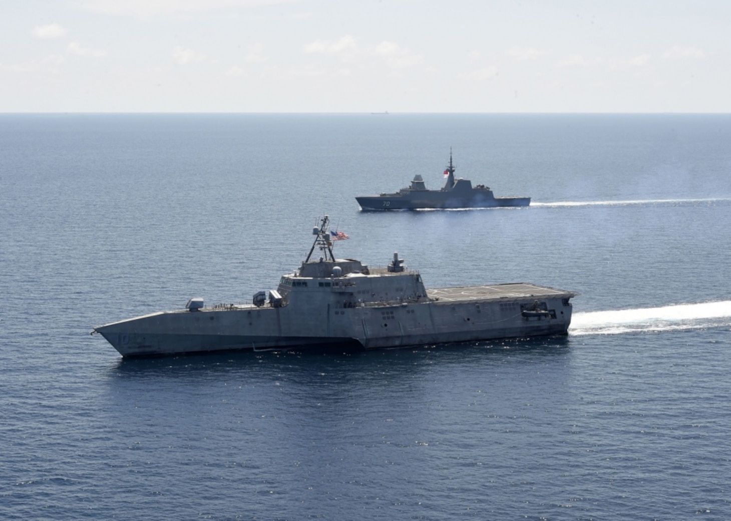 SOUTH CHINA SEA (May 25, 2020) The Independence-variant littoral combat ship USS Gabrielle Giffords (LCS 10), left, exercises with the Republic of Singapore Navy Formidable-class multi-role stealth frigate RSS Steadfast (FFS 70) in the South China Sea, May 25, 2020. Gabrielle Giffords, part of Destroyer Squadron Seven, is on a rotational deployment, operating in the U.S. 7th Fleet area of operations to enhance interoperability with partners and serve as a ready-response force.