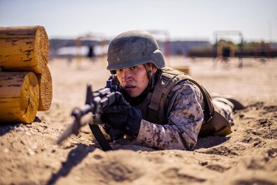 A recruit with Echo Company, 2nd Recruit Training Battalion participates in the Bayonet Assault course at Marine Corps Recruit Depot, San Diego, May 20, 2020.