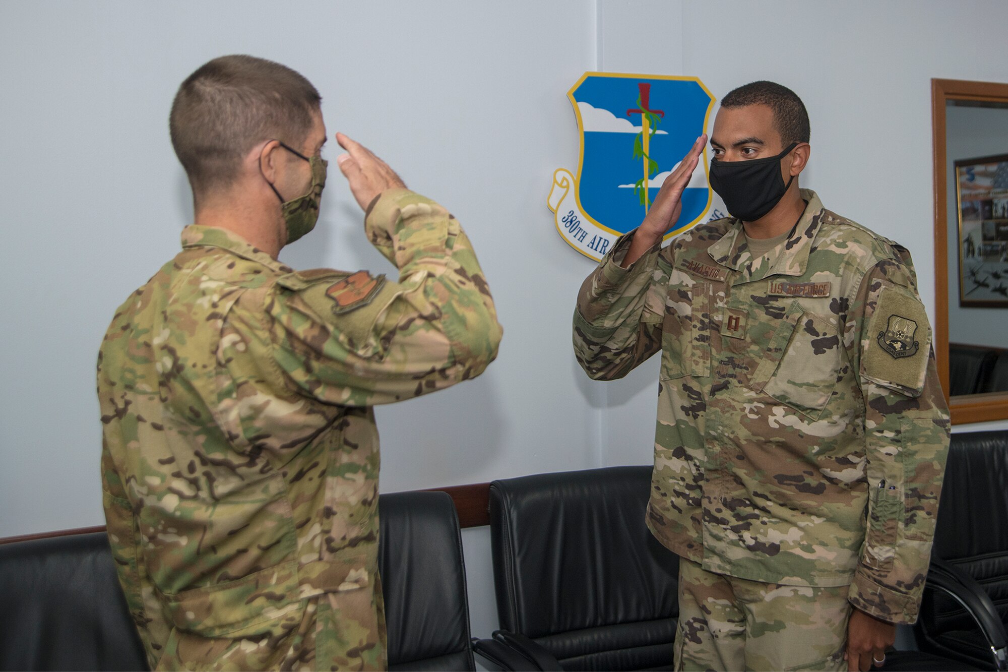 U.S. Air Force Brig. Gen. Lansing Pilch, commander of the 380th Air Expeditionary Wing, recognizes presents a coin to an Airman on behalf of U.S. Air Force Lt. Gen. Joseph Guastella, commander of U.S. Air Forces Central Command, during a virtual troop engagement at Al Dhafra Air Base, United Arab Emirates, at Al Udeid AB, Qatar, May. 13, 2020.
