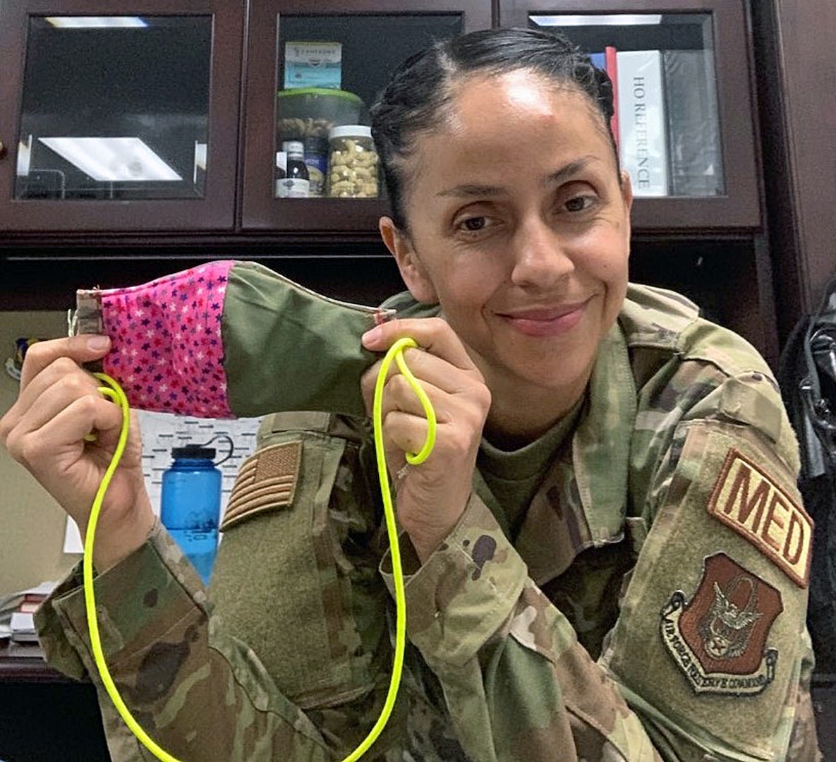 Master Sgt. Jeanett Vielman displays one of the handmade masks she donated for the students at the Defense Language Institute English Language Center at Joint Base San Antonio-Lackland.