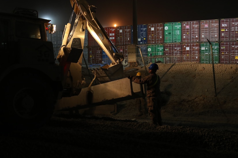 U.S Army Soldiers from the 30th Armored Brigade Combat Team work to repair a roadway on May 20, 2020 in Kuwait. The Soldiers from the 30th ABCT work during the night to avoid the extreme heat of the day, and be able to work longer on the project. (U.S. Army photo by Sgt. Andrew Winchell)