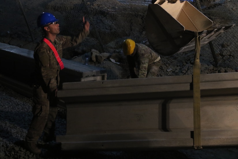 U.S Army Soldiers from the 30th Armored Brigade Combat Team work to repair a roadway on May 20, 2020 in Kuwait. The Soldiers from the 30th ABCT work during the night to avoid the extreme heat of the day, and be able to work longer on the project. (U.S. Army photo by Sgt. Andrew Winchell)