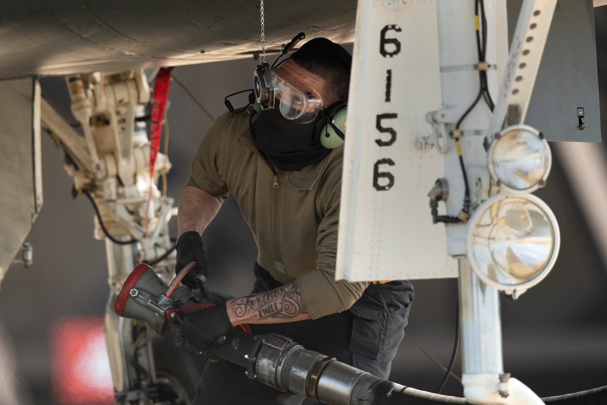 A crew chief assigned to the 493rd Fighter Squadron Aircraft Maintenance Unit prepares to perform "hot pit” refueling on an F-15C Eagle at Royal Air Force Lakenheath, England, May 20, 2020. Crew chiefs work closely with 48th Logistics Readiness Squadron Airmen to deliver over 350,000 gallons of JP-8 fuel per week, keeping the Liberty Wing ready to deliver combat airpower. (U.S. Air Force photo by Airman 1st Class Jessi Monte)