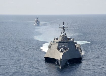 SOUTH CHINA SEA (May 25, 2020) The Independence-variant littoral combat ship USS Gabrielle Giffords (LCS 10), front, exercises with the Republic of Singapore Navy Formidable-class multi-role stealth frigate RSS Steadfast (FFS 70) in the South China Sea, May 25, 2020. Gabrielle Giffords, part of Destroyer Squadron Seven, is on a rotational deployment, operating in the U.S. 7th Fleet area of operations to enhance interoperability with partners and serve as a ready-response force.