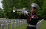 A U.S. Marine plays “Taps” during a Memorial Day Ceremony at the Quantico National Cemetery, Triangle, Va., May, 25.