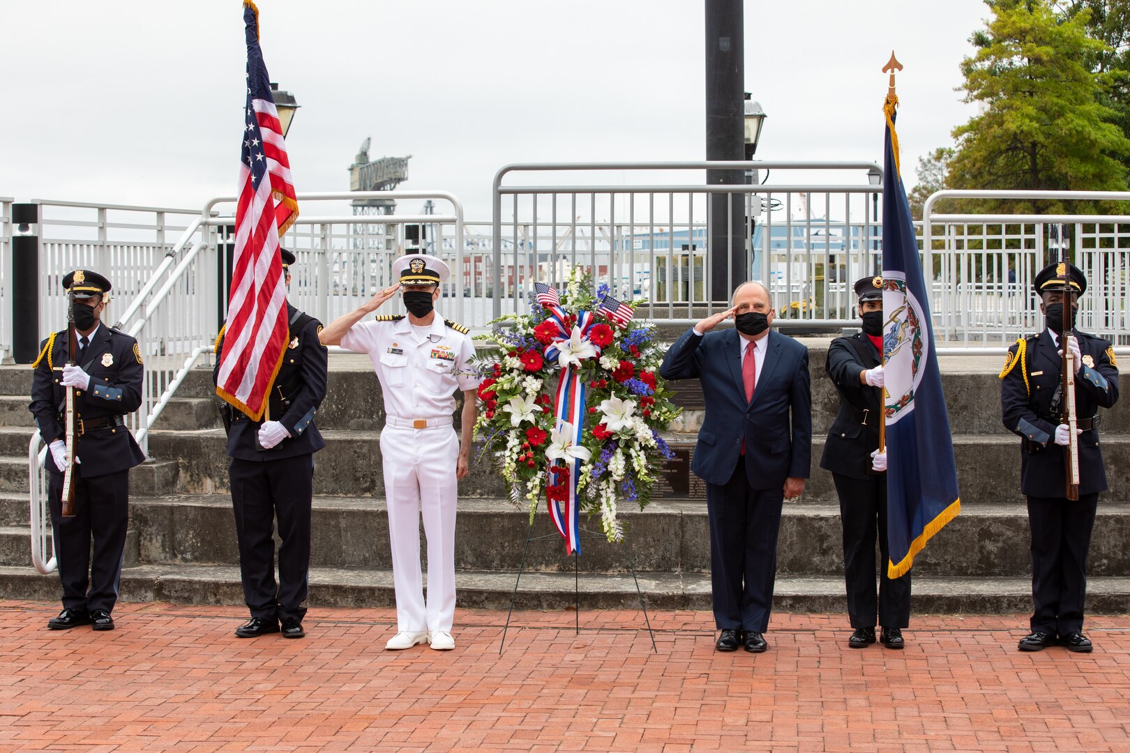 The Honorable Mayor John Rowe, City of Portsmouth, and Norfolk Naval Shipyard Commander Capt. Kai Torkelson lay a wreath for the fallen at High Street Landing Flagpole Stage as part of the City of Portsmouth's Memorial Day Observance.