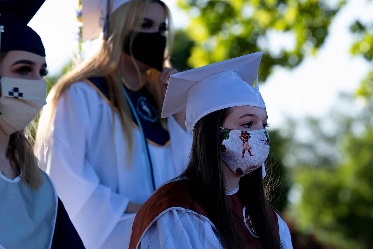 Seniors at their high school graduation ceremony.
