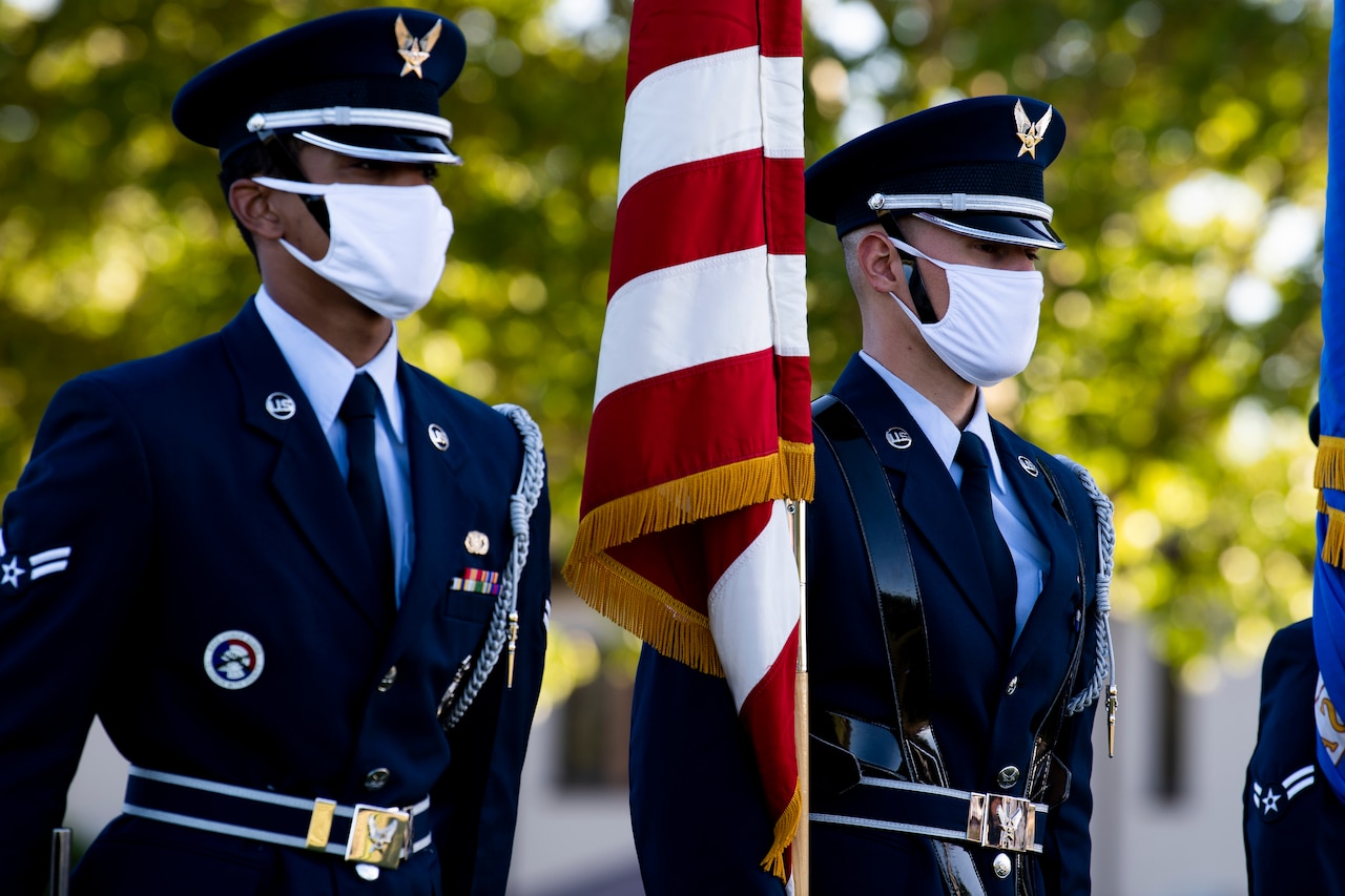 An Air Force honor guard at a high school graduation ceremony.