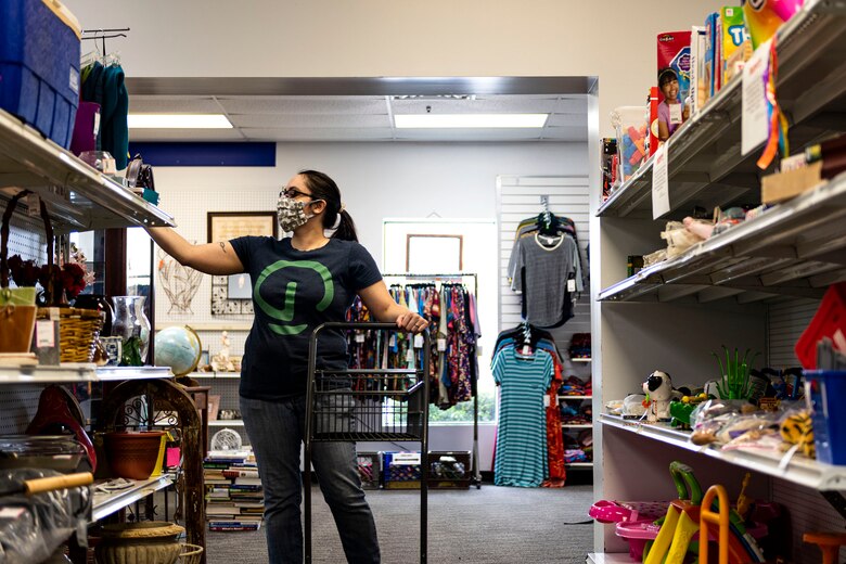 Photo of a patron shopping at the Thrift Shop.