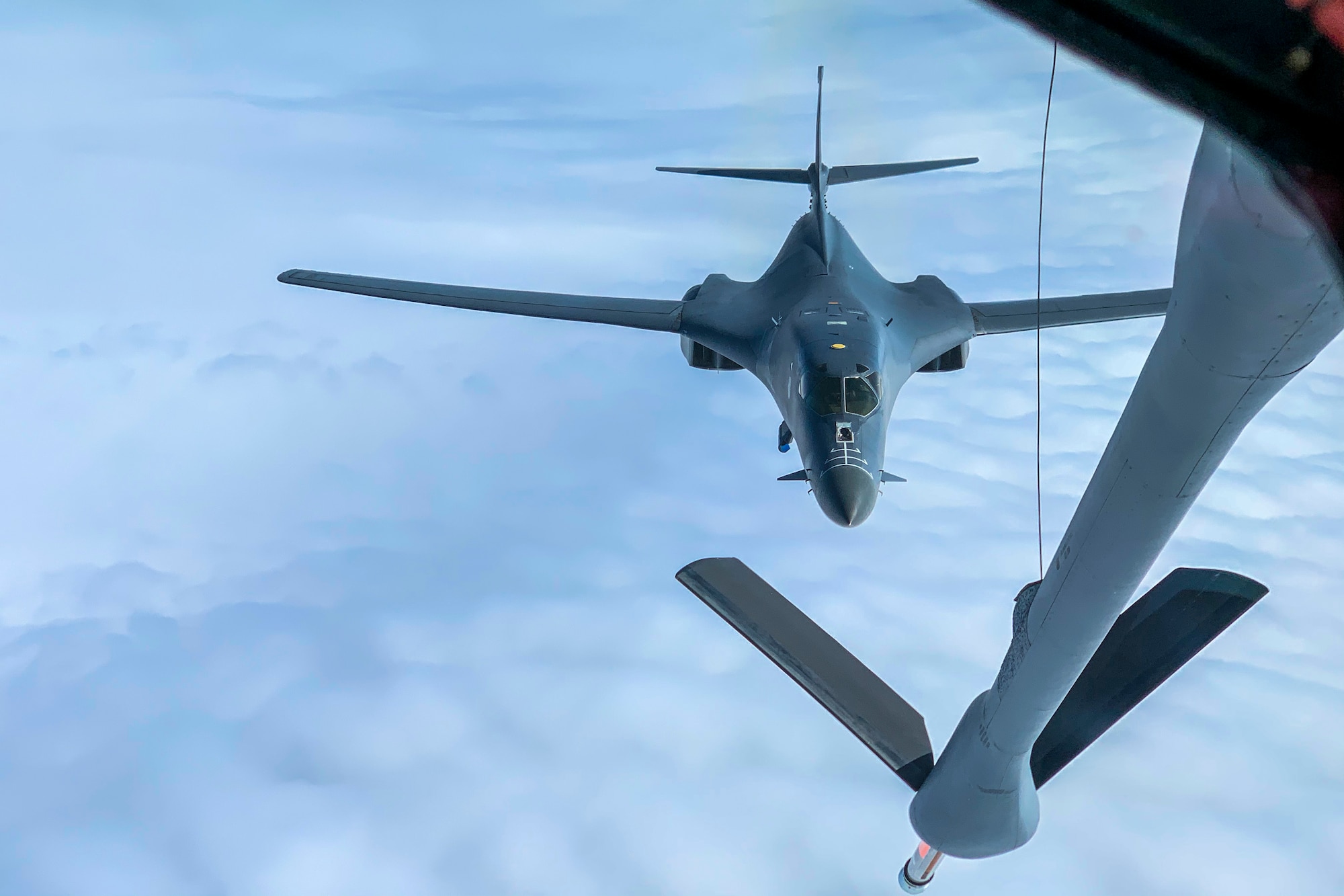 A U.S. Air Force B-1B Lancer assigned to the 9th Expeditionary Bomb Squadron closes in on a KC-135 Stratotanker assigned to the 93rd Air Refueling Squadron in Alaska, May 21, 2020. During the Bomber Task Force mission, B-1s from Dyess Air Force Base received fuel from KC-135s assigned to Fairchild Air Force Base.  (U.S. Air Force photo by Airman 1st Class Aaron Larue Guerrisky)