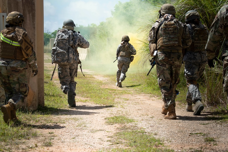 Students in a Tactical Combat Casualty Care class run to secure a location during the “care under fire” portion of their training, May 13, 2020 at Andersen Air Force Base, Guam.