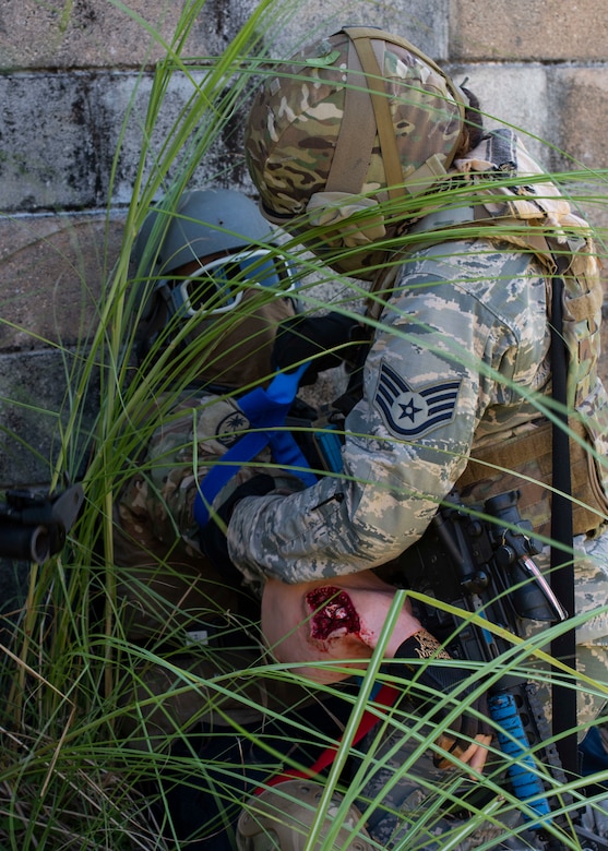 A tourniquet is applied to a “wounded” friendly while operating in the Care Under Fire phase of Tactical Combat Casualty Care, May 13, 2020 at Andersen Air Force Base, Guam.
