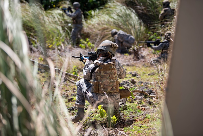 Students suppress simulated incoming fire so they can find and treat wounded patients during the Tactical Combat Casualty Care course, May 15, 2020, at Andersen Air Force Base, Guam.