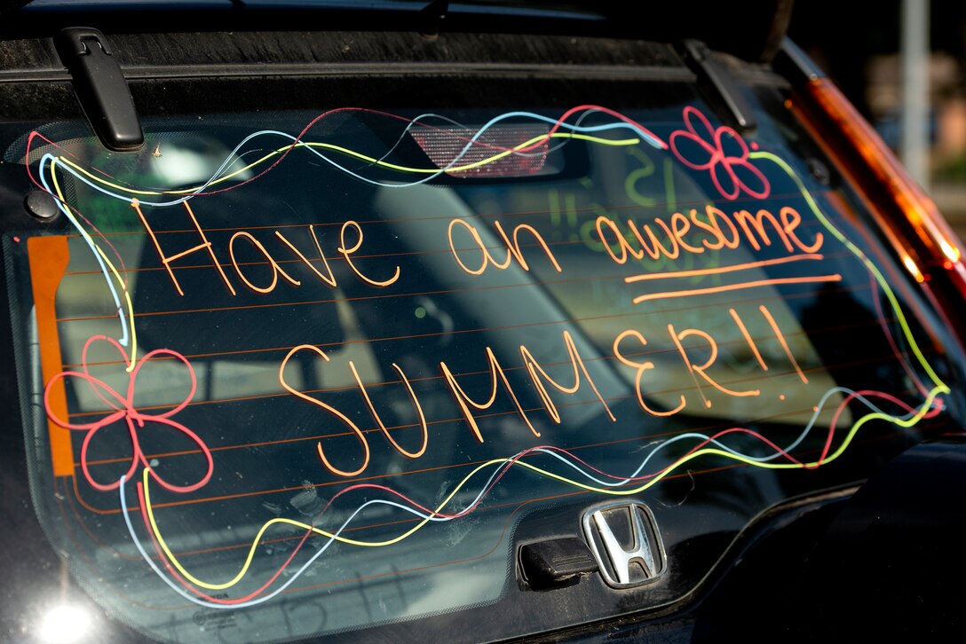 Faculty and staff members from Liberty Intermediate School decorated their vehicles and participated in an end of school year "summer sendoff" car parade at Royal Air Force Lakenheath, England, May 26, 2020. The school supports 4th and 5th grade students from the greater RAF Lakenheath community. (U.S. Air Force photo by Airman 1st Class Jessi Monte)