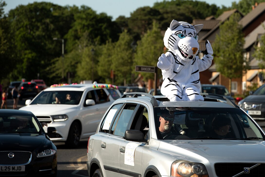 Faculty and staff members from Liberty Intermediate School participate in an end of school year car parade at Royal Air Force Lakenheath, England, May 26, 2020. Nearly 30 cars were featured in the parade, as well as the school mascot, "Blizzard" the white tiger. (U.S. Air Force photo by Airman 1st Class Jessi Monte)