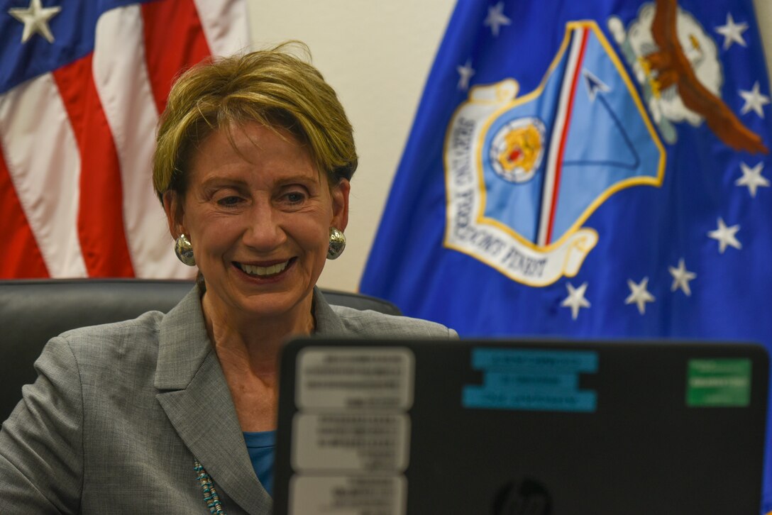 Woman participates in a conference call.