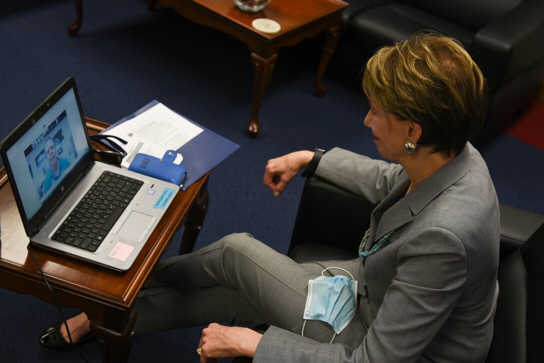 Woman participates in a conference call.