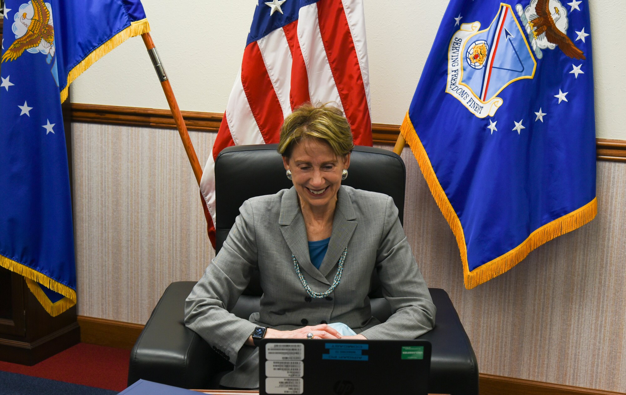 Woman participates in a conference call.