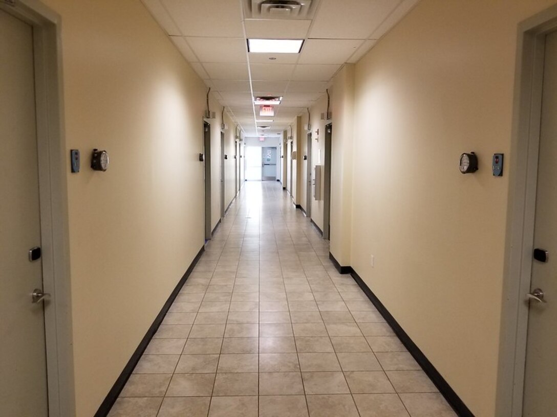 This is a view of the hallway of the USVI Army National Guard Regional Training Institute, which was converted into an alternate care facility for COVID-19 patients on St. Croix Island. Each room holds two patients. -U.S. Army photo by Alex Cubbage