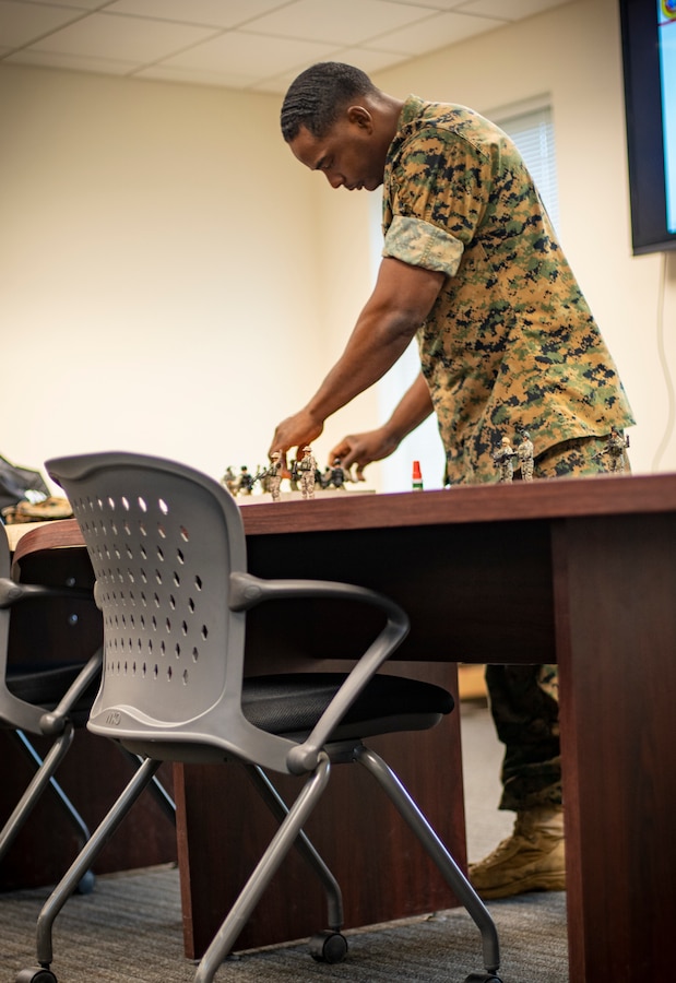 Staff Sgt. Xavier Refuge, a reconnaissance Marine with Special Purpose Marine Air-Ground Task Force - Southern Command, teaches an infantry patterns and techniques class during a certification exercise at Marine Corps Base Camp Lejeune, North Carolina, April 20, 2020.The CERTEX is the culmination exercise that will test the training and readiness of the Marines and Sailors of the SPMAGTF-SC for certification to deploy. Once certified, the SPMAGTF-SC will be ready to conduct crisis response, theater security cooperation training and general engineering projects alongside partner nation militaries in Latin America and the Caribbean.  Refuge is a native of New Orleans, Louisiana. (U.S. Marine Corps photo by Sgt. Andy O. Martinez)