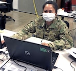 Lt. Col. Maria Espiritu, a clinical laboratory officer, works at Joint Base San Antonio-Fort Sam Houston April 20 in support of the Department of Defense COVID-19 Response mission. Espiritu provides guidance to multiple clinical laboratories in the U.S. that provide testing for military medical professionals mobilized to support areas heavily impacted by COVID-19.