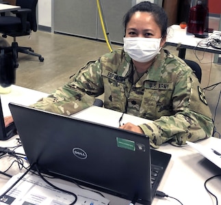Lt. Col. Maria Espiritu, a clinical laboratory officer, works at Joint Base San Antonio-Fort Sam Houston April 20 in support of the Department of Defense COVID-19 Response mission. Espiritu provides guidance to multiple clinical laboratories in the U.S. that provide testing for military medical professionals mobilized to support areas heavily impacted by COVID-19.