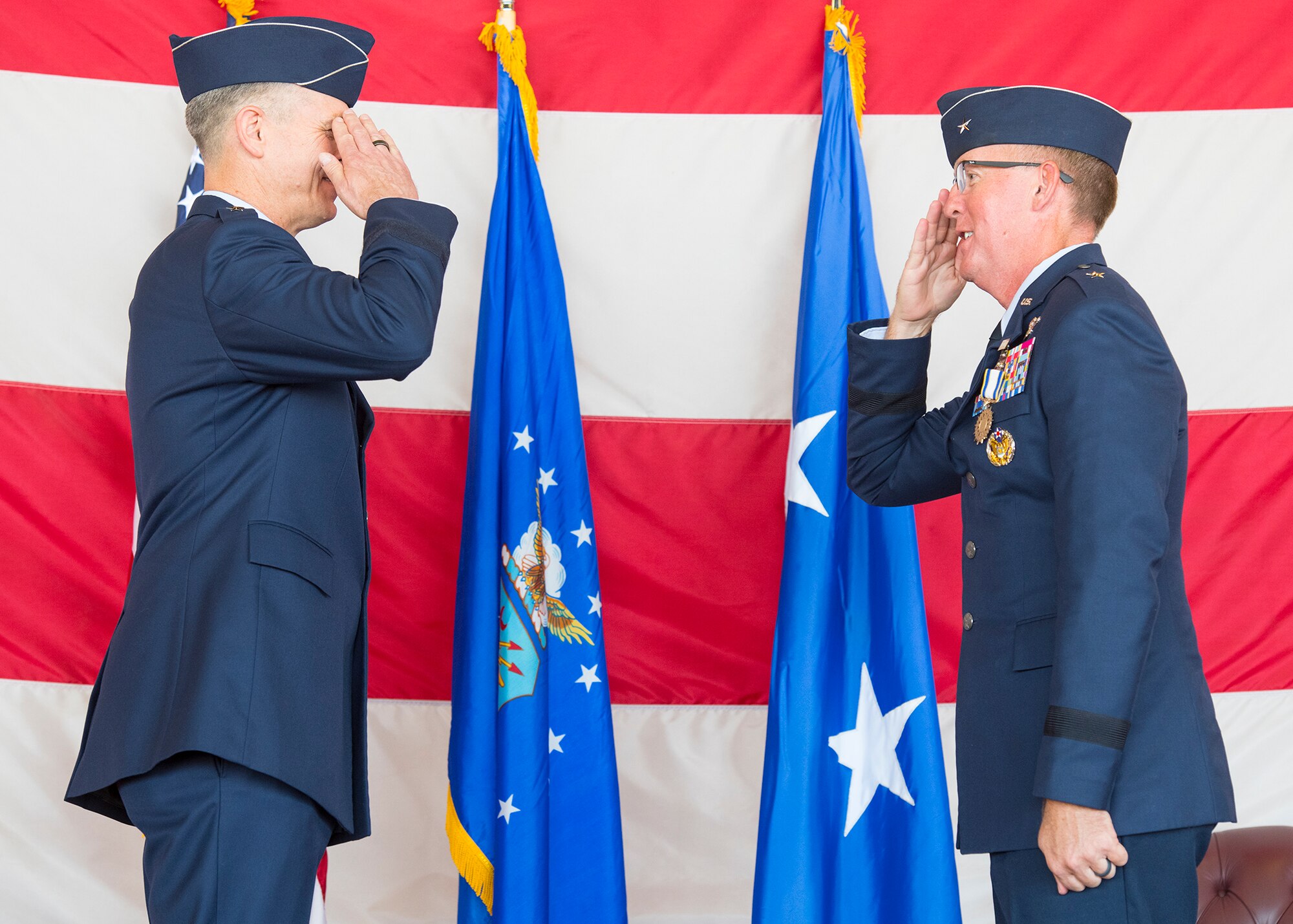 Brig. Gen. Todd Canterbury, 56th Fighter Wing outgoing commander (right), salutes Maj. Gen. Craig Wills, 19th Air Force commander, Joint Base San Antonio-Randolph, Texas, May 27, 2020, during the 56th FW Change of Command ceremony at Luke Air Force Base, Ariz.