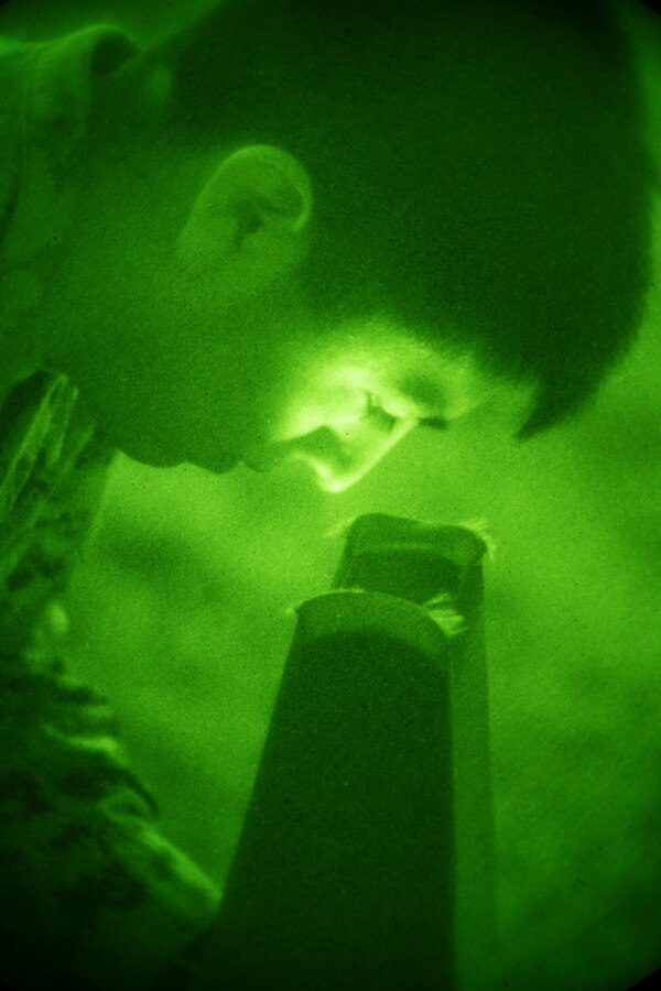 Sgt. Adrian Ortiz, an intelligence analyst with Special Purpose Marine Air-Ground Task Force - Southern Command, looks inside a vehicle operator hand controller during an RQ-11B Raven Operator Course at Marine Corps Base Camp Lejeune, North Carolina, April 27, 2020. SPMAGTF-SC Marines participated in the course to test their knowledge and skills when employing a small unmanned aircraft system.  Marines and Sailors with SPMAGTF-SC are conducting a variety of pre-deployment training events and qualifications in order to enhance crisis response preparedness. These events assist the Marines and Sailors with providing security cooperation training and engineering projects alongside partner nation military forces in Latin America and the Caribbean. Ortiz is a native of Albuquerque, New Mexico. (U.S. Marine Corps photo by Sgt. Andy O. Martinez)