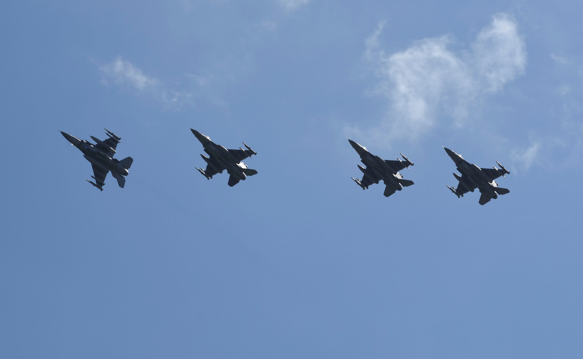 U.S. Air Force F-16 Fighting Falcons, assigned to the 480th Fighter Squadron, fly in formation over Spangdahlem Air Base, Germany, to participate in a large force exercise within the North Sea airspace, U.K., May 27, 2020. Despite the current COVID-19 crisis, it is paramount to maintain a ready force to deter potential adversaries and assure our partners and allies. During mission operations, U.S. Air Force personnel are adhering to guidance from the Department of Defense, Centers for Disease Control and Prevention, and host nation public health agencies. (U.S. Air Force photo by Senior Airman Melody W. Howley)