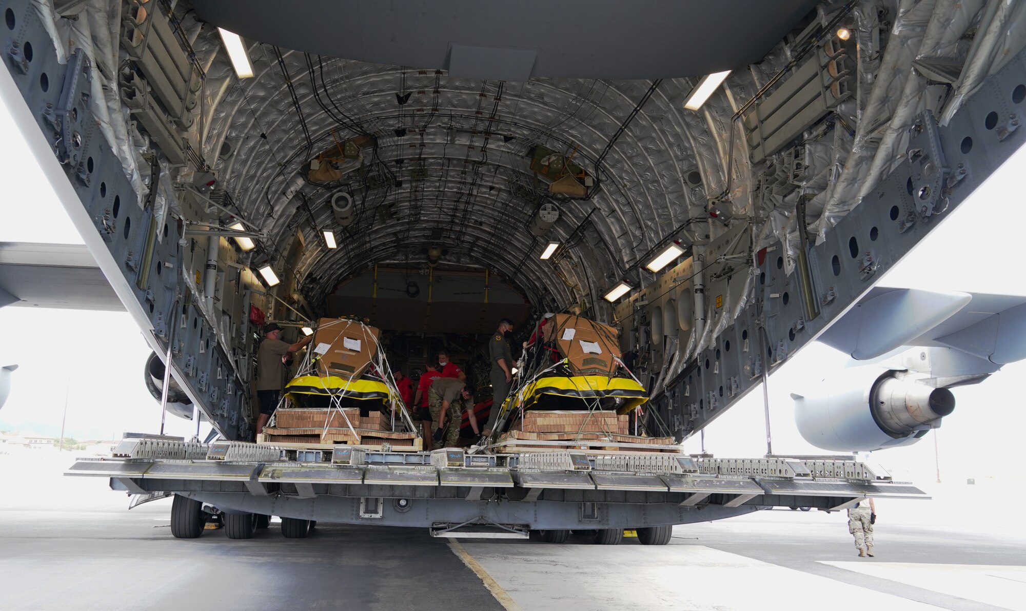 U.S. Air Force 647th Logistics Readiness Squadron and Pararescue Airmen prepare a C-17 Globemaster III for NASA’s SpaceX Demonstration Mission 2 on Joint Base Pearl Harbor-Hickam, Hawaii, May 26th, 2020. In preparation for the historic launch of a manned crew into space, several units from Team Hickam assisted the deployment of U.S. Air Force Guardian Angel Pararescue forces from the 58th Rescue Squadron, Nellis Air Force Base, Nevada as part of Task Force 45, facilitated by 45th Operations Group, Detachment 3, Human Space Flight Support located at Patrick Air Force Base, Florida. (U.S. Air Force photo by Airman 1st Class Erin Baxter)
