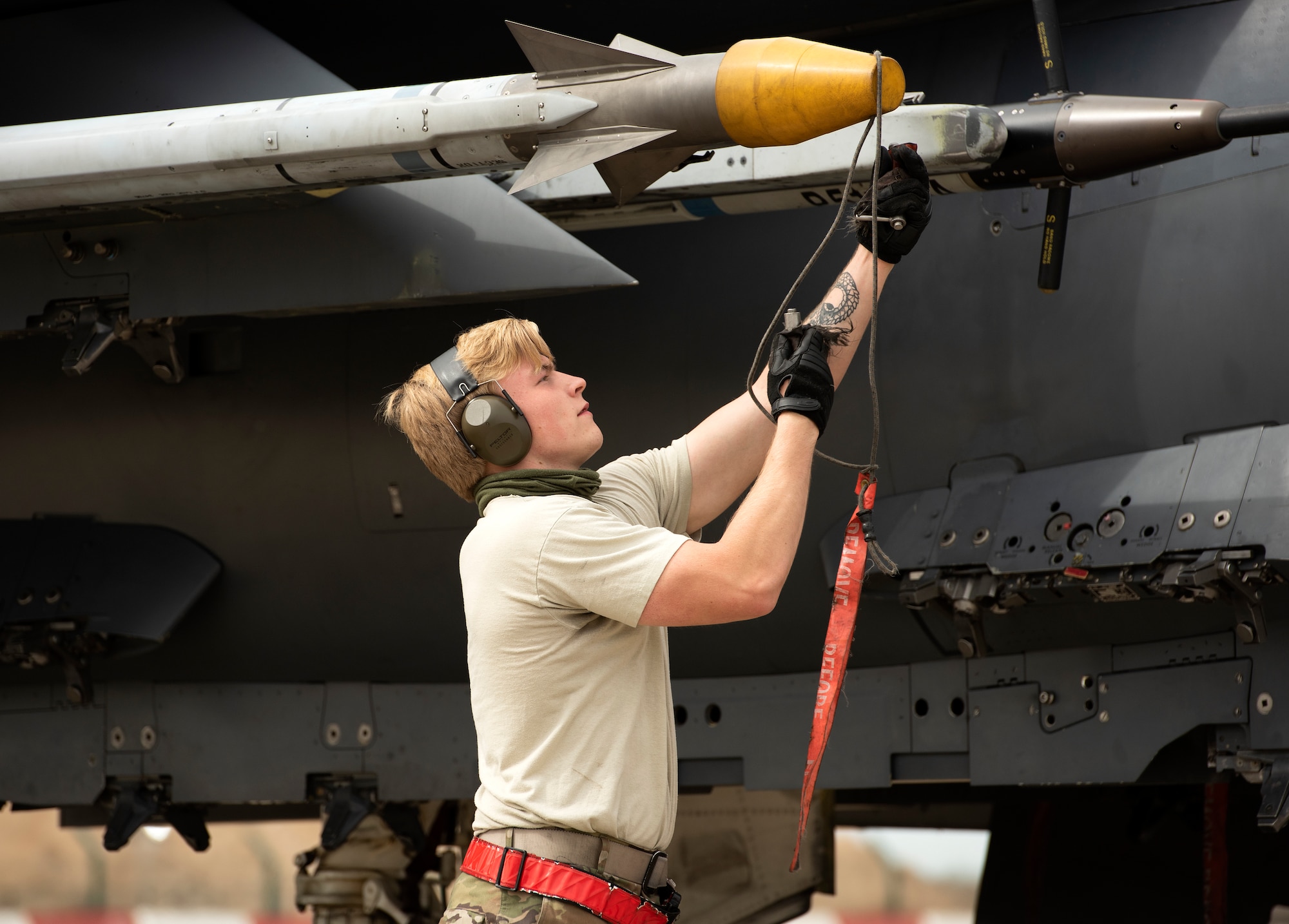 A crew chief assigned to the 494th Fighter Squadron Aircraft Maintenance Unit prepares an F-15E Strike Eagle for takeoff at Royal Air Force Lakenheath, England, May 27, 2020. During a large force exercise with other U.S. Air Forces in Europe-Air Forces Africa units, 48th Fighter Wing aircrew conducted Dissimilar Air Combat Training in order to enhance combat readiness and increase tactical proficiency needed to maintain a ready force capable of ensuring the collective defense of the NATO alliance. (U.S. Air Force photo by Airman 1st Class Jessi Monte)