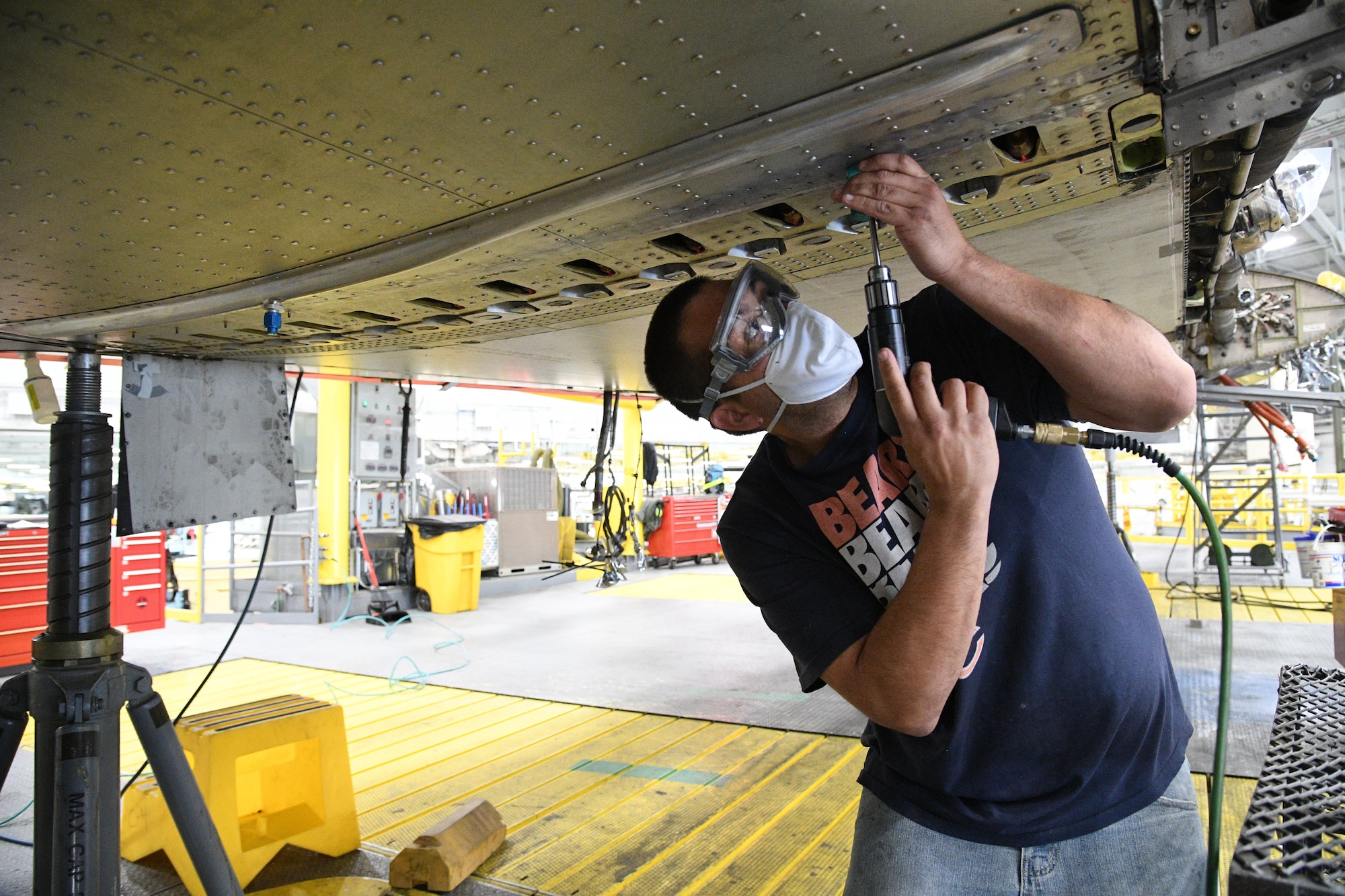 Joe Reyes, 309th Aircraft Maintenance Group sheet metal mechanic, reams a fastener hole on a C-130 wing at Hill Air Force Base, Utah, May 8, 2020. Comprised of seven maintenance squadrons and more than 2,000 personnel, the 309th AMXG performs depot maintenance, repair and overhaul on A-10, C-130, F-16, F-22, F-35 and T-38 airframes. (U.S. Air Force photo by R. Nial Bradshaw)