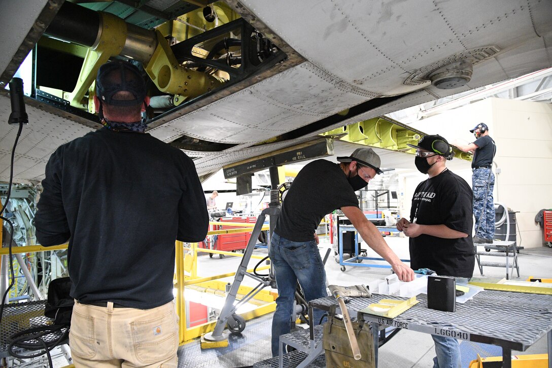 A 309th Aircraft Maintenance Group crew perform depot maintenance on a C-130 at Hill Air Force Base, Utah, May 8, 2020. Comprised of seven maintenance squadrons and more than 2,000 personnel, the 309th AMXG performs depot maintenance, repair and overhaul on A-10, C-130, F-16, F-22, F-35 and T-38 airframes. (U.S. Air Force photo by R. Nial Bradshaw)