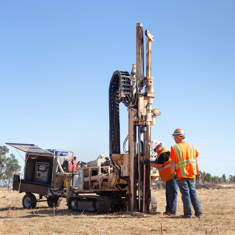 Contractors use a drilling rig with a sensor-tipped tube to sniff out potential contaminants at a former missile site.