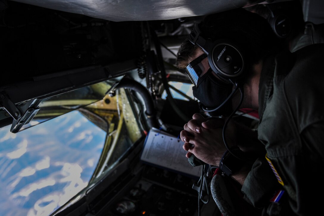 U.S. Air Force Airman 1st Class Jacob Ellis, a 93rd Air Refueling Squadron boom operator, waits for an inbound B-1B Lancer to receive fuel over Alaska, May 21, 2020. Bomber Task Force missions demonstrate the credibility of U.S. forces to address a diverse and uncertain security environment. The Airmen and crews from Dyess arrived at Andersen AFB May 1 to conduct BTF missions in the Indo-Pacific. (U.S. Air Force photo by Airman 1st Class Aaron Larue Guerrisky)
