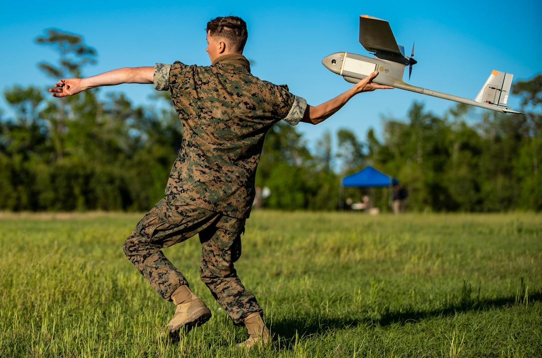 A U.S. Marine launches an RQ-11B Raven during an RQ-11B Raven Operator Course at Marine Corps Base Camp Lejeune, N.C., April 27.
