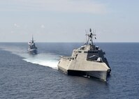 SOUTH CHINA SEA (May 25, 2020) The Independence-variant littoral combat ship USS Gabrielle Giffords (LCS 10), right, exercises with the Republic of Singapore Navy Formidable-class multi-role stealth frigate RSS Steadfast (FFS 70) in the South China Sea, May 25, 2020. Gabrielle Giffords, part of Destroyer Squadron Seven, is on a rotational deployment, operating in the U.S. 7th Fleet area of operations to enhance interoperability with partners and serve as a ready-response force.