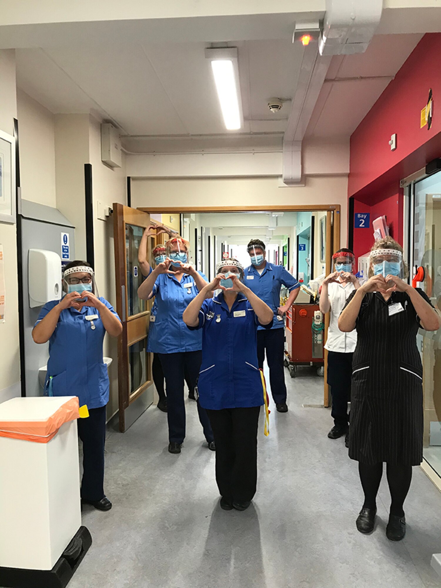 Nurses pose for a photo wearing face shields produced by Joseph and Dawn Smith. The Smiths have produced over 1,000 face shields for the local community that has been dispersed to multiple hospitals and medical centers in the local community such as Hinchingbrooke, Addenbrookes, Nightingale, West Suffolk and others. (Courtesy Photo)