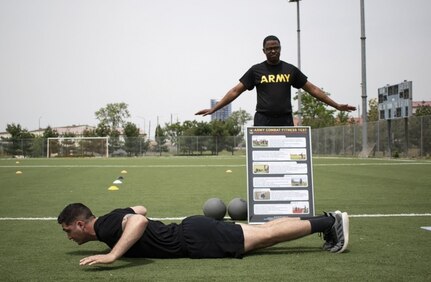 Sgt. 1st Class Phelps (top) gives instructions on the Army Combat Fitness Test, or ACFT, on U.S. Army Garrison Humphreys, South Korea, on May 14, 2020.