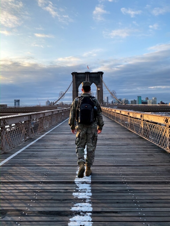 U.S. Army Engineer Research and Development Center’s Cold Regions Research and Engineering Laboratory Research Associate Army 1st Lt. Eoghan Matthews walks across the Brooklyn Bridge on his way to work at the U.S. Army Corps of Engineers (USACE) New York District, March 26, 2020. 
Matthews was activated to assist the USACE New York District with completing site assessments, which are provided to local, state and federal partners, so that decisions can be made about where and when alternate care facilities are constructed as additional support to hospitals during the COVID-19 outbreak.