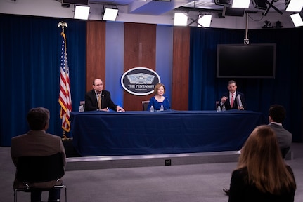 Three people at a desk