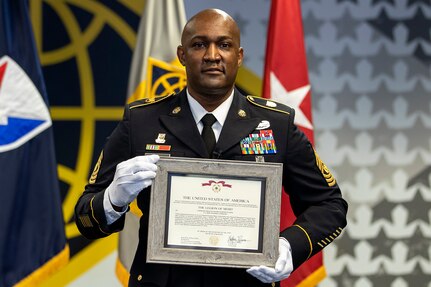 Command Sgt. Maj. Courtney M. Ross, U.S. Army Financial Management Command senior enlisted advisor, poses for a photo after being presented a Legion of Merit medal by Brig. Gen. Mark S. Bennett during his retirement ceremony at the Maj. Gen. Emmett J. Bean Federal Center in Indianapolis May 15, 2020. Gen. Gustave F. Perna, U.S. Army Materiel Command commanding general, awarded the medal to Ross for his exceptionally meritorious service during his career. (U.S. Army photo by Mark R. W. Orders-Woempner)