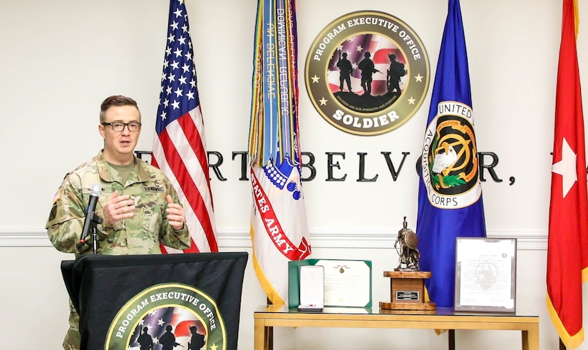 Lt. Col. Stephen Miller as the new leader of Product Manager Soldier Protective Equiment (PdM SPE), recognizes Lt. Col. Ginger Whitehead for her leadership, at Fort Belvoir