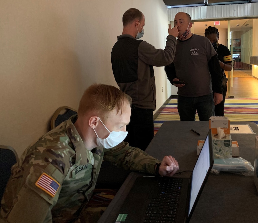 A soldier reviews medical information.