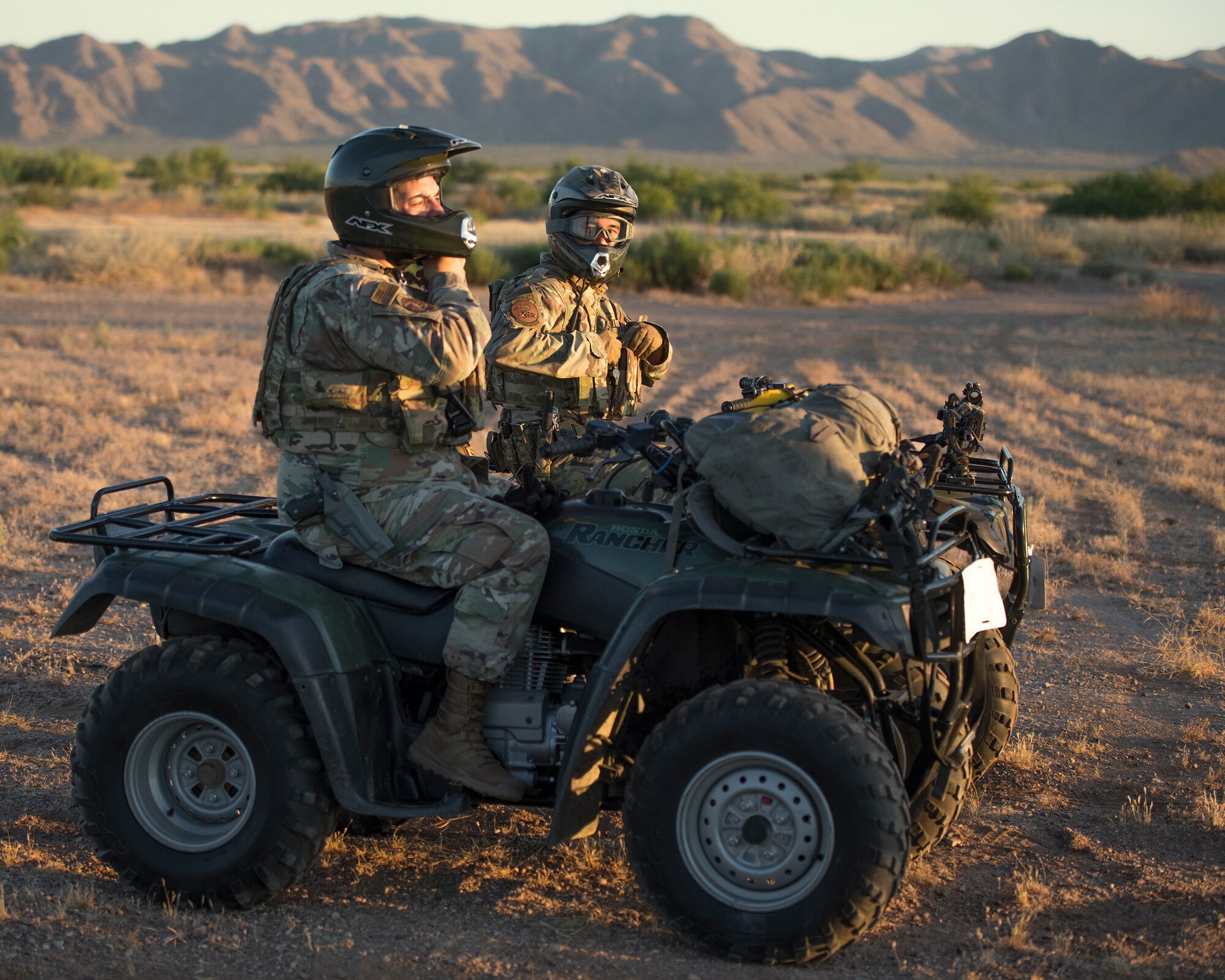 Tech. Sgt. Jose Martinez, 56th Security Forces Squadron Defense Force day-shift flight sergeant (left), and Tech. Sgt. Joseph Campbell, 56th SFS Defense Force noncommissioned officer in charge of training and confinement, prepare for a patrol May 21, 2020, at the Luke Air Force Base auxiliary range in Ariz.