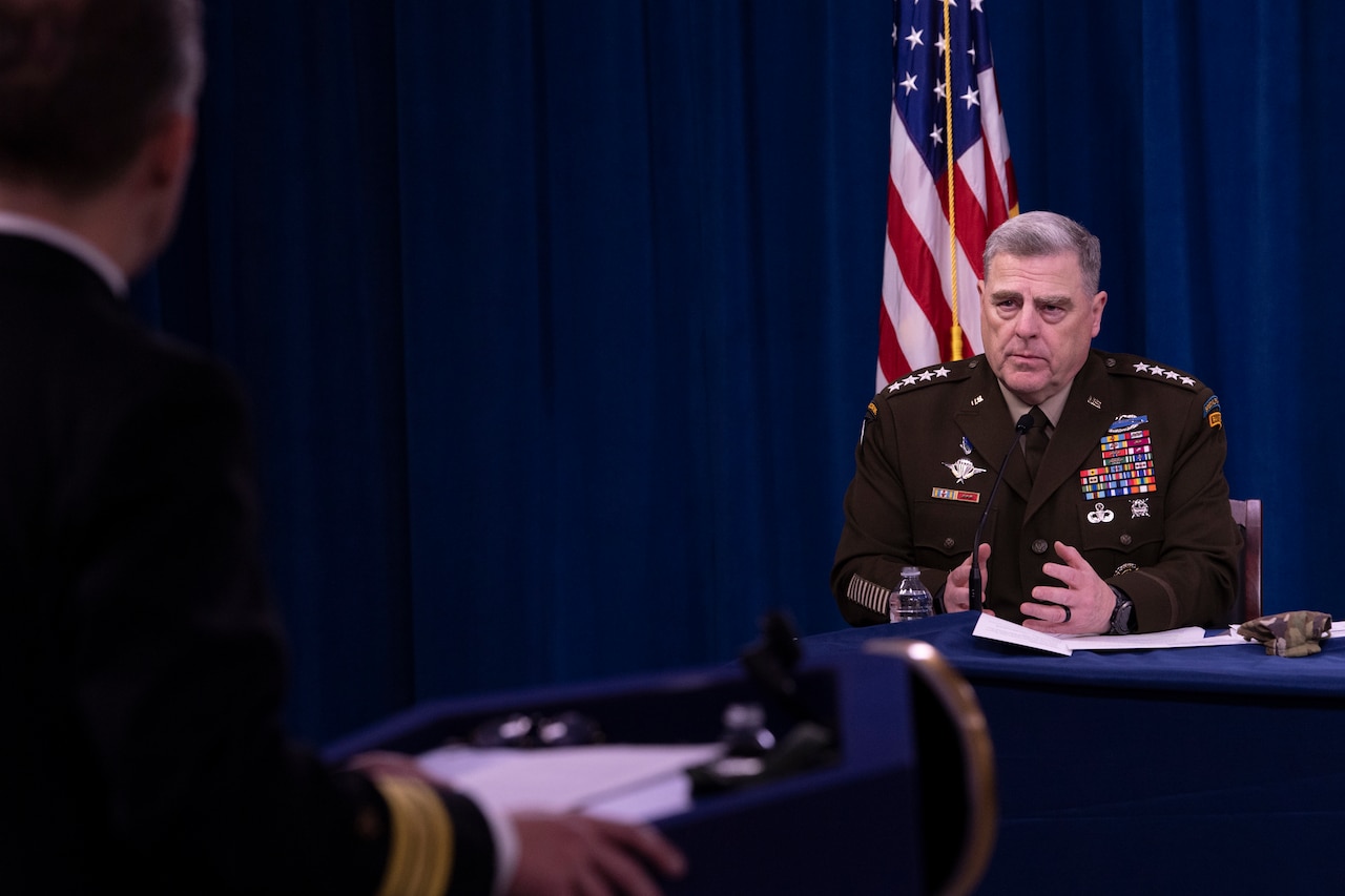 A military officer speaks at a briefing.